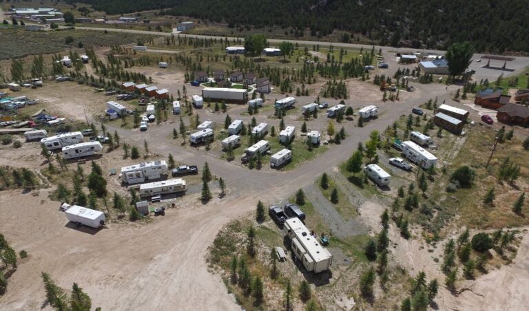 Dutch John Resort At Flaming Gorge RV-Park Aerial View Showing Campground RV Sites Tent Sites And Luxury Cabins.