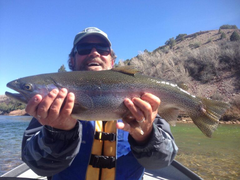 Guys holding a fish they just caught