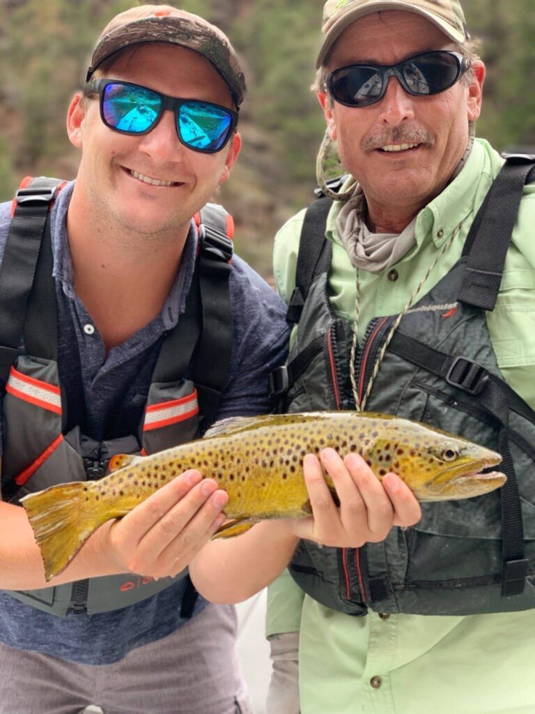 Guys holding a fish they just caught